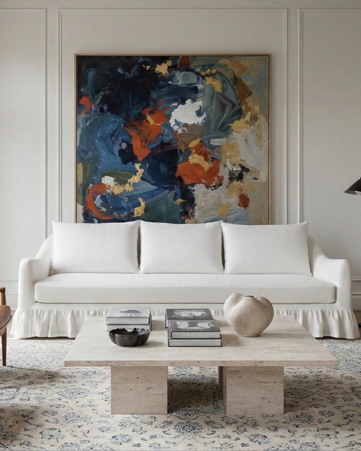 Living room with a white Crafted Maisie 3 seat sofa, abstract painting, and wooden coffee table.